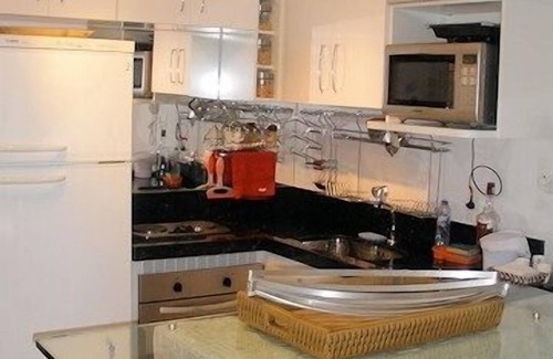 Enseada Condominio | Apartamento en condominio de estilo polinesio frente al mar - 1 suite