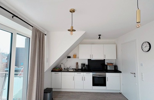 Neuharlingersiel Apartamento | Apartment KÖÖK III Heimathafen - modern, balcony, close to the beach