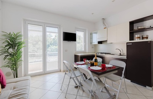 Torre Grande Apartamento | Apartment 'La Baia Del Sole' with Shared Pool, Wi-Fi and Air Conditioning