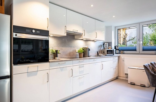 Brodten Apartamento | Apartamento 'Meerlust' con terraza privada, jardín privado y Wi-Fi