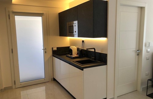 Villa San Pietro Apartamento | Apartamento "Residence Meridian Unità 7" cerca de la playa, piscina, Wi-Fi, A/C y balcón