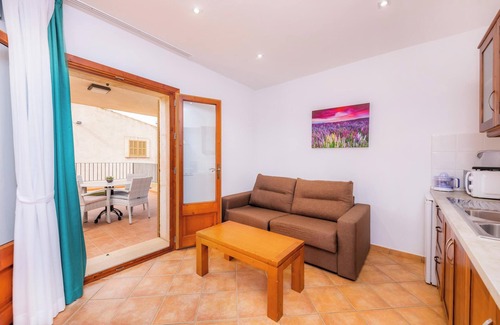 Ariany Apartamento | Apartamento 'S Hort Can Capità Familiar Terraza 4' cerca del mar con piscina compartida y Wi-Fi