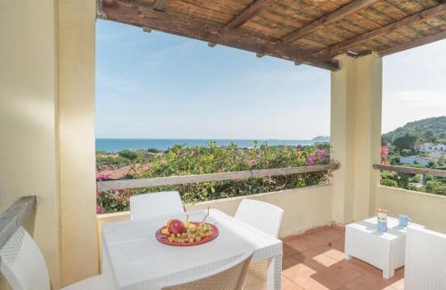 Costa Rei Apartamento | Apartment Stella con piscina comune - REI101 by Interhome