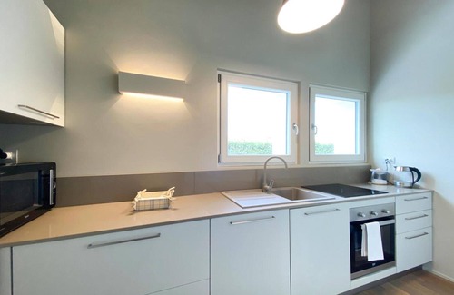 Ponti sul Mincio Apartamento | Apartment 'Time To Relax Resort - Melograno' with Shared Pool, Wi-Fi and Air Conditioning