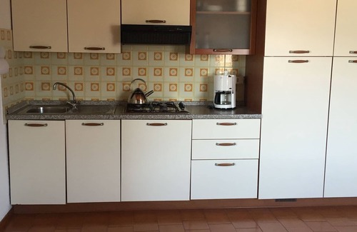 Castelletto Apartamento | Apartamento con vista al lago, en una zona tranquila con jardín y terraza.