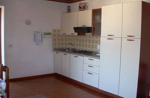 Castelletto Apartamento | Apartamento con vista al lago, en una zona tranquila con jardín y terraza.
