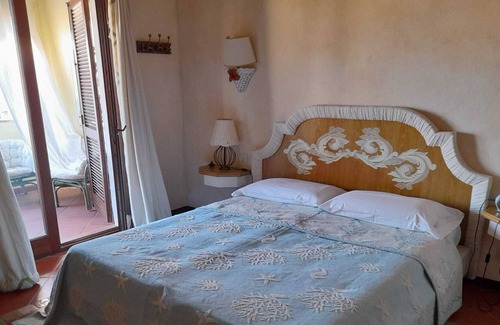 Capo Ferro Casa | Apartamento con vistas al mar a 30 metros de la playa de Cala del Faro