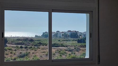 Achakkar Apartamento | Appartement avec piscines, vue sur mer et accès à la plage à Achakar Hill, Tanger.