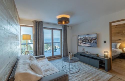 Courchevel Apartamento | Appartement Neuf 65m² Courchevel Moriond, 2 Chambres + Cabine, Balcon, Parking Couverts, Skis aux Pieds - FR-1-563-127