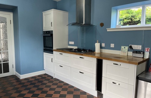 Wigtown Cabaña | Apple cottage: A cosy cottage with log burners and mature garden. Pet-friendly.