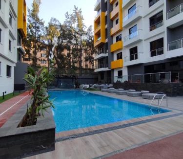 Kilimani Apartamento | Artsy & spacious studio with Pool, Gym & Sauna