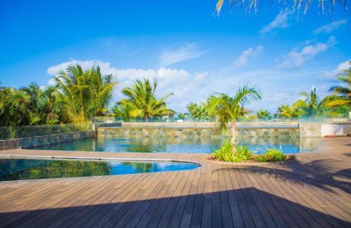Roches Noires Apartamento | Azuri Apartment with Beach, Pools, Gym, Golf, Shops, Restaurants, Spa, Boat activities, Tennis &Paddle court, kids corner