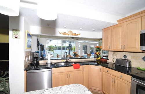 Port Canaveral Casa | Banana River Beauty-Five bedroom waterfront home with heated pool and spa