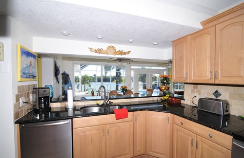Port Canaveral Casa | Banana River Beauty-Five bedroom waterfront home with heated pool and spa