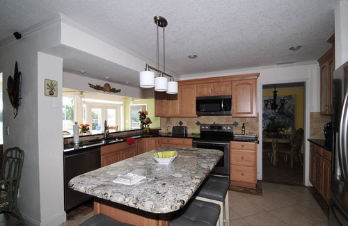 Port Canaveral Casa | Banana River Beauty-Five bedroom waterfront home with heated pool and spa