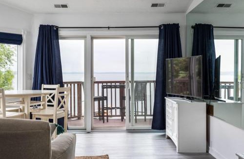 Traverse City Casa | Beach 321 with Vaulted Ceilings Pool Hot Tub and Stunning Views from Private Deck