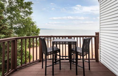 Traverse City Casa | Beach 321 with Vaulted Ceilings Pool Hot Tub and Stunning Views from Private Deck