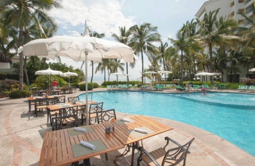 Isla Iguana Apartamento | Beach resort w/balcony ft lush pools, dining, fitness, spa & resort activities.