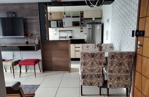 Praia Grande Apartamento | Beachfront condominium, 1-bedroom apartment with views of the mountains and sunset