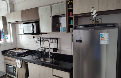 Praia Grande Apartamento | Beachfront condominium, 1-bedroom apartment with views of the mountains and sunset