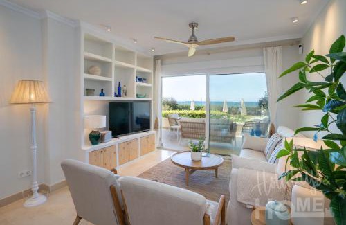 Nikki Beach Apartamento | Beachfront complex Neptuno III , sea views, pool and garden,Elviria