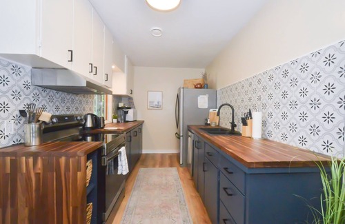 Courtenay Casa | Beachfront Cottage: Brick Fireplace + Ocean Deck