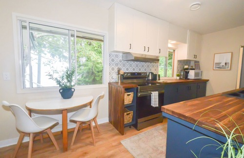Courtenay Casa | Beachfront Cottage: Brick Fireplace + Ocean Deck