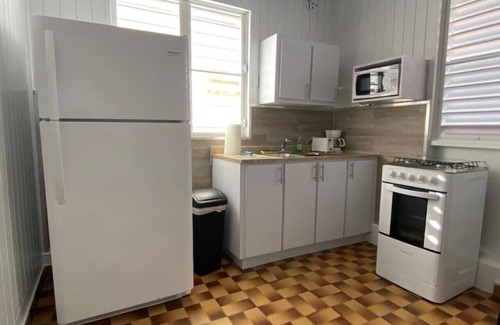 El Combate Cabina | Beachfront Rustic Cabin by Sunset Village - Purple