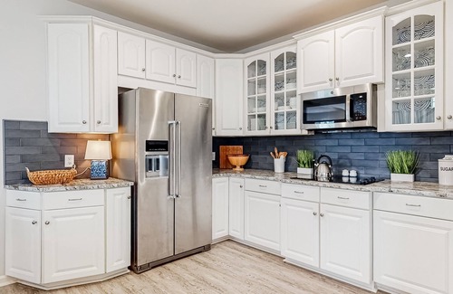Sunset Island Casa | Beachside home with a gas fireplace, washer/dryer, pools, dock, & fitness room