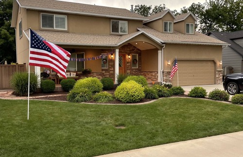River Bottoms Casa | Beachy Home in Provo. Large deck with builtin hot tub, Fire pit, Palapa