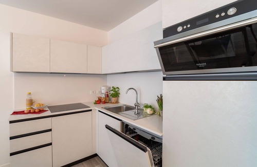Lignano Sabbiadoro Apartamento | Precioso apartamento para 4 personas con A/C, WIFI, TV, balcón, mascotas permitida y aparcamiento
