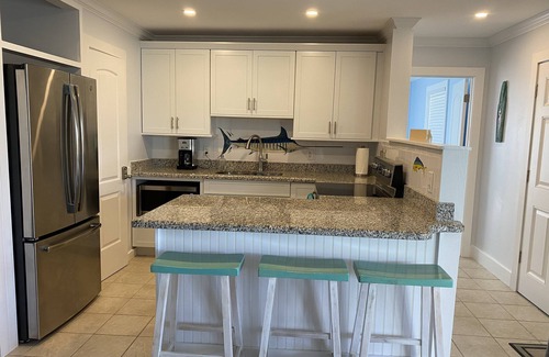 Treasure Cay Villa | Hermosa Villa de playa con una malla en porche 2BR / 2 BA