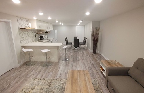 Southwest Calgary Casa | Beautiful two bedroom and an office lower level suit