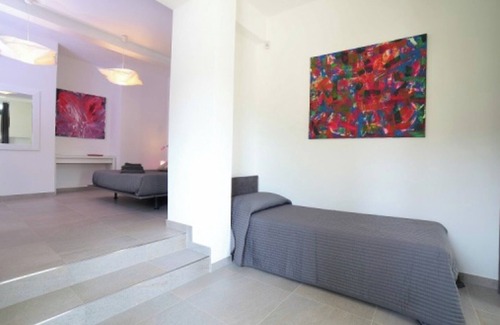 Palazzolo dello Stella Cama Y Desayuno | Bed and Breakfast Loggia degli Artisti 'Deluxe Room Two' con Piscina Compartida y Aire Acondicionado