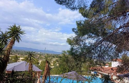 Lliria Casa | Bedroom with private bathroom and Two-Bedroom Family Suite in quiet forest country house 80m2 large swimming pool music town Lliria The garden and swimmingpool and garden are shared