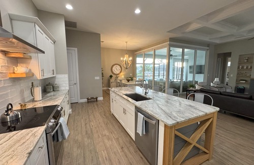 South Gulf Cove Casa | Bela-Vita-Charming 3-bedroom canal front pool home with 2 master suites