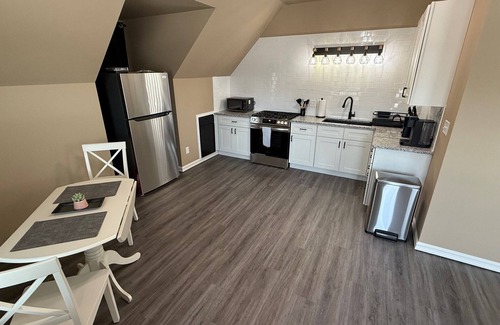 Broken Arrow Casa | Blue Loft on Main is walking distance to the Downtown Rose District