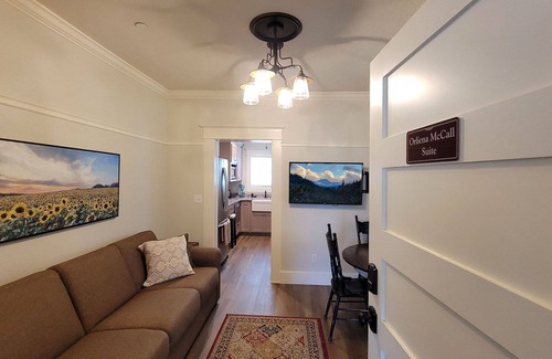 Historic Railroad District Casa | BookStayHop -RedTail Orliena Suite, Relaxing Hot tub and a Tesla Station