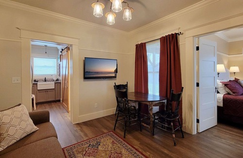 Historic Railroad District Casa | BookStayHop -RedTail Orliena Suite, Relaxing Hot tub and a Tesla Station