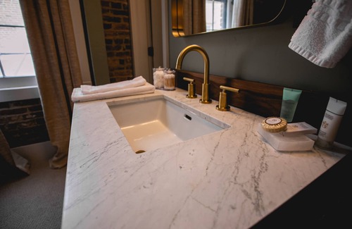 Jacksonville Hotel | Boutique 1 BR King Suite in historic downtown Jacksonville. Walk to the Britt Festival! Enjoy a king bed, modern rain shower, and charming Inn details. Ideal for a romantic or weekend getaway.