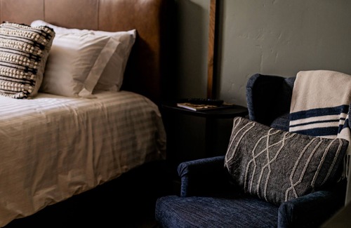 Jacksonville Hotel | Boutique 1 BR King Guest Room in historic Jacksonville, OR. Features a plush King bed, Nespresso machine, and charming Inn details. Perfect for a comfortable, walkable downtown escape.