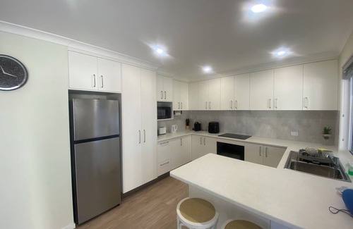 Scarness Casa | Brand New 2BR Coastal Home w/ Outdoor Entertaining – 350m to Beach, Pier & cafes