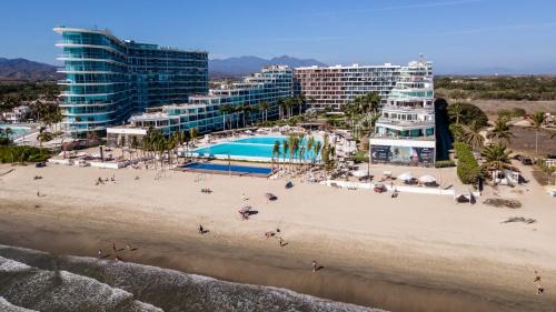 Flamingos Apartamento | Brand New Condo Aria Ocean 501 by Kivoya