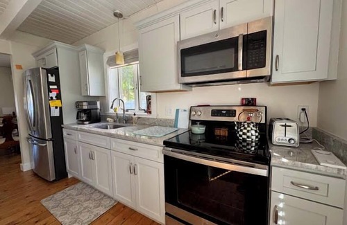 East Falmouth Casa | BRAND NEW LISTING! 2BD Pond Front Home--A/C, Sun Room, Enclosed Outdoor Shower, Wonderful Water Views