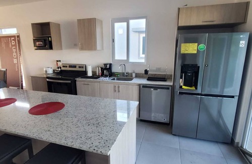 Paquera Casa | Brand new private home in a gated colony. 5 min walk to beach and all facilities