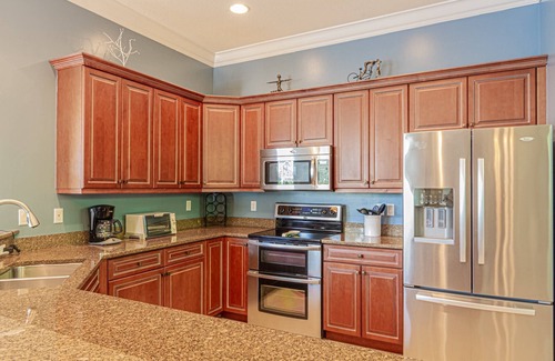 Central Naples Casa | Briarwood home w/ heated pool/spa-outdoor kitchen-retractable awning-private lake view