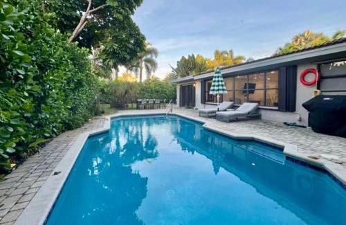 South Corals Villa | Bright Fort Lauderdale Villa with Private Heated Pool, Modern Décor and Palm-Lined Outdoor Oasis
