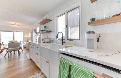 Houghton Lake Casa | Bright Houghton Lake Home w/ Boat Dock + Fire Pit