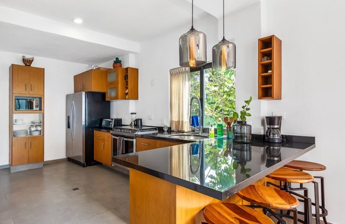 Conchas Chinas Condominio | Bright ocean-view 2-story condo near beach with pool, balcony & full kitchen