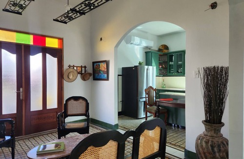 Arecibo Pueblo Casa | Built in 1942 and recently restored. Natural light and green lush vegetation.
